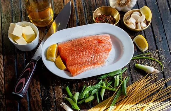 Raw Salmon and ingredients for Ketogenic Diet meal preparation