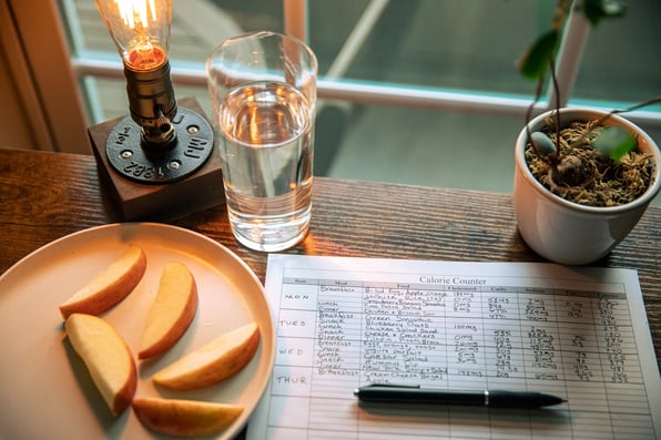 Pen and Diet Calendar on Table